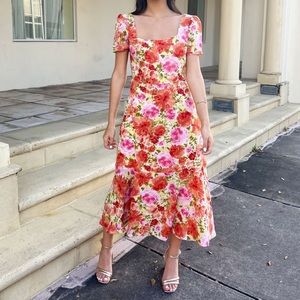 Stunning midi dress with square neckline, lined, ruffled hem.